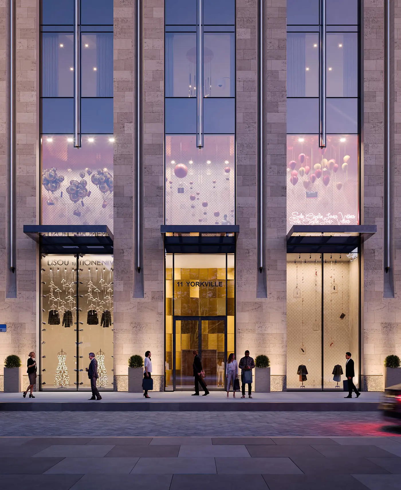 The lobby entrance of 11 Yorkville at dusk